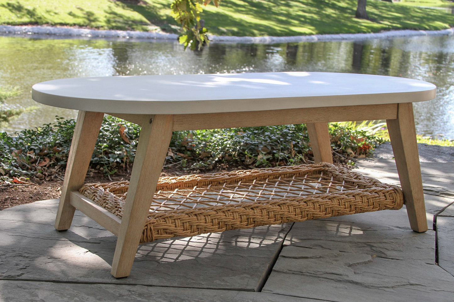 Sahara Outdoor Oval Ivory Composite Coffee Table 51" x 25"