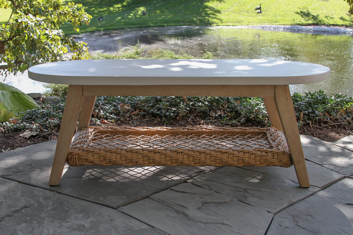 Sahara Outdoor Oval Ivory Composite Coffee Table 51" x 25"