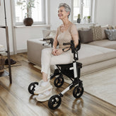 HERCULES Folding Rollator Walker with Adjustable Height, 360 Swivel, and Hand Brakes in White/Black