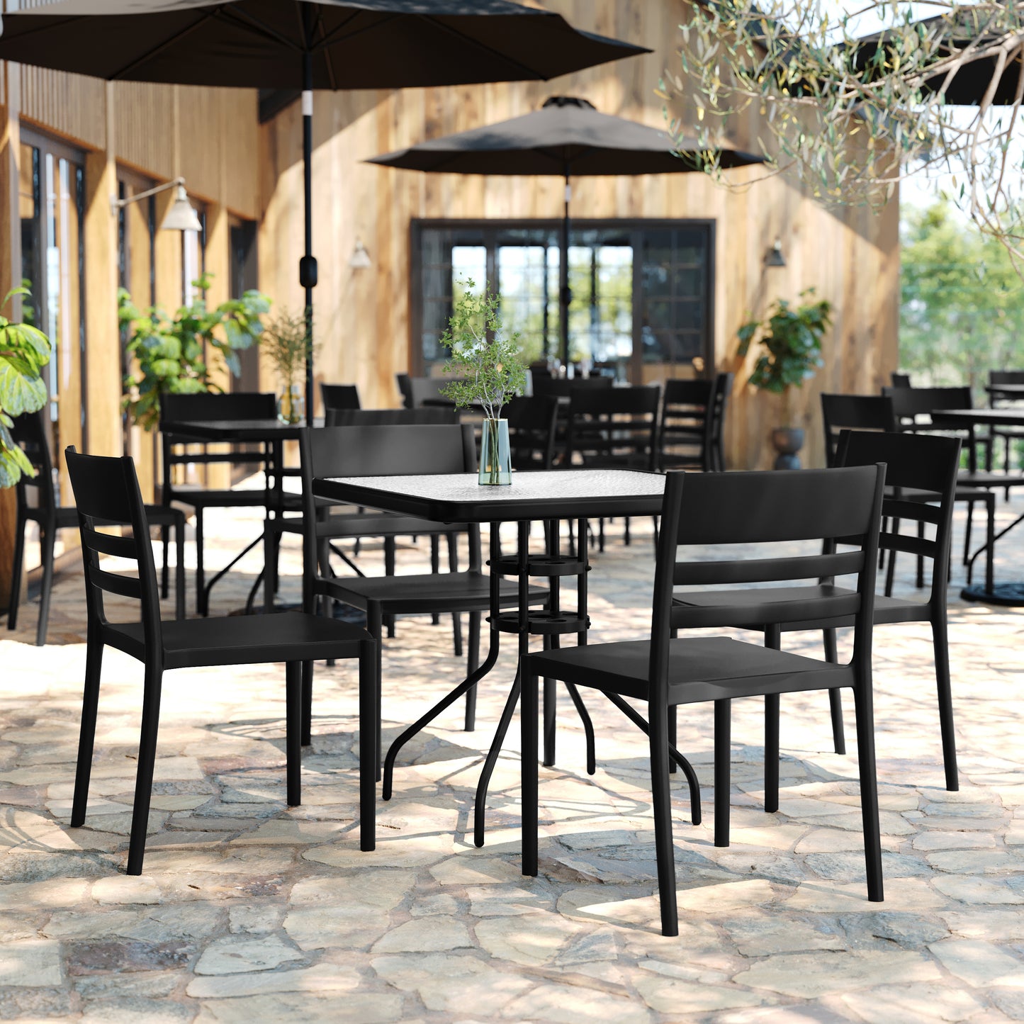 Bridgeport Indoor-Outdoor Stacking Patio Chair with Slatted Backrest, Commercial All-Weather Resin Chair in Black