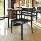 Bridgeport Indoor-Outdoor Stacking Patio Chair with Slatted Backrest, Commercial All-Weather Resin Chair in Black