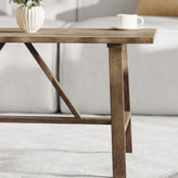 Eli Solid Wood Farmhouse Coffee Table, Trestle Style Accent Table in Rustic Brown
