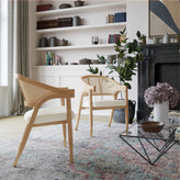 Naomi Commercial Cane Rattan Dining and Accent Chair with Solid Wood Frame Featuring Gold Tipped Legs and Beige Padded Seat in Natural