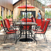 Brazos 7 Piece Outdoor Patio Dining Set - 55" Tempered Glass Patio Table with Umbrella Hole, 6 Red Flex Comfort Stack Chairs