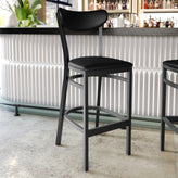 Wright Commercial Barstool with 500 LB. Capacity Black Steel Frame, Black Vinyl Boomerang Back, and Black Vinyl Seat