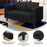 HERCULES Artemis Black LeatherSoft Reception Loveseat with 2 AC Outlets/1 USB/1 USB-C Ports and Solid Wood Walnut Legs with Adjustable Floor Glides