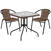 28 inch square glass metal table with rattan edging and 2 rattan stack chairs