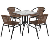 28 inch square glass metal table with rattan edging and 4 rattan stack chairs